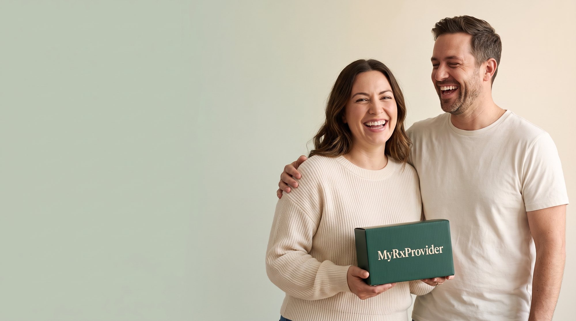 A smiling couple holding a MyRxProvider box